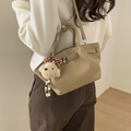 Minimalist beige pebble leather bucket bag with cute teddy bear charm and silver hardware - Khaki With Pendant