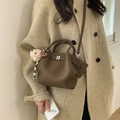 Brown lychee leather bucket bag with plush bear charm and detachable strap for women - Brown with Pendant