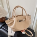 Elegant beige bucket bag with lychee texture and silver metal buckle, handheld style - Khaki