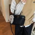 Black vintage leather bucket bag with gold hardware and a grey plush rabbit charm - Black with Pendant