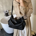 Minimalist black faux leather hobo tote bag with functional side pockets and twist lock - Black