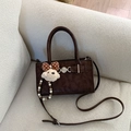 Detail of dark brown matte crossbody bag with cute plush bear and pearl charms - With Charm / Brown