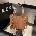 Brown leather bucket bag with top handles, wooden beads, and black gift box packaging - Brown with Pendant