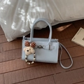 Light blue leather handbag featuring a metal buckle and cute teddy bear charm - With Charm / Blue