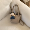 Detail of beige lychee grain leather bucket bag with cute blue teddy bear pendant - Khaki With Pendant