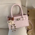 Pink crossbody bag with silver medallion and cute beige teddy bear charm accessory - With Charm / Pink