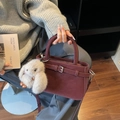 Elegant burgundy leather top-handle bag with silver buckle and white rabbit pendant - With Charm / Burgundy
