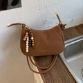 Brown matte crescent shoulder bag with golden logo and colorful beaded tassel charm - With Pendant / Brown