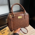 Vintage brown leather crossbody bag with gold hardware and top handle straps - Brown