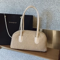 Beige faux shearling shoulder bag with smooth leather straps on a wooden shelf - Khaki