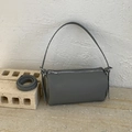 Elegant grey cylinder crossbody bag in pebble leather with adjustable shoulder strap - Gray