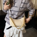 Detail of off-white crescent crossbody bag with gold chain and embossed fashion logo - Off White