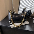 Minimalist black crescent shoulder bag with bold gold chain and leather strap details - Black