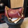 Vintage burgundy half-moon crossbody bag with gold chain strap and smooth leather finish - Burgundy