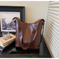 Brown vintage glossy PU leather bucket bag with wide shoulder strap for women - Brown with Pendant
