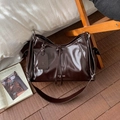 Large dark brown tote bag in oily leather finish with wide strap and lazy breeze tag - Brown
