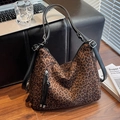 Large leopard print crossbody tote bag with adjustable leather strap and tassel detail - Brown