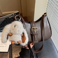 Dark brown retro underarm bag with metal buckle and plush rabbit charm held by hand - Coffee with Pendant