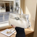 Elegant cream bucket bag with shiny wrinkled texture and silver buckle detail - White