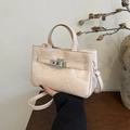 Elegant cream bucket bag in glossy pleated leather with a metallic twist lock - Pink
