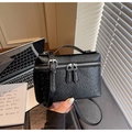 Elegant black ostrich leather textured mini square handbag with top handle and crossbody strap - Black