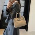 Elegant beige faux leather tote bag with silver buckle in a stylish crossbody carry style - Beige Grey
