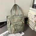 Sac à dos fonctionnel en toile gris-vert avec écusson GTYLF et multiples poches zippées - Sac à bandoulière vert