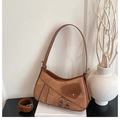 Detail of retro brown underarm bag with silver metallic eyelets and zippers - Brown