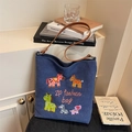 Blue canvas tote bag featuring cute cartoon horse embroidery and brown leather strap - Blue