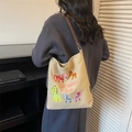 Beige canvas tote bag with colorful animal embroidery and adjustable brown leather strap - Khaki