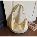 Creamy beige glossy hobo bag with dual front zippers and polished leather finish - Yellow