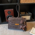 Dark chocolate suede tote bag with golden twist lock and dachshund charm in retro setting - Coffee with Pendant