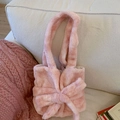 Elegant pink plush shoulder bag with large decorative bow for spring fashion trends - Pink