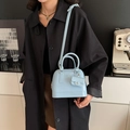 Fashionable light blue jelly crossbody bag with top handle and matching mini pouch - Blue