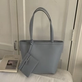 Close-up of litchi texture on grey-blue tote bag with a matching small zipper pouch - Blue