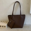 Dark brown pebble leather tote bag with white contrast stitching and a matching pouch - Brown