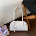 White minimalist PU leather bowling handbag with long straps and star pendant detail - White