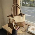 Retro cream and brown contrast shoulder bucket bag with beaded charm and wooden handle - White Brown With Pendant