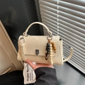 Cream white vintage small crossbody bag with beaded pendant and silver metallic hardware - White