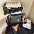 Black litchi grain leather crossbody bag with silver hardware and wooden bead charm - Black