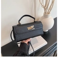 Classic black crossbody handbag with cross-grain texture and golden twist-lock closure - Black