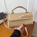 Champagne gold textured leather crossbody bag with top handle and gold metallic twist lock - Gold