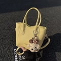 Yellow pebble leather bucket bag with long strap and cute puppy doll charm detail - Yellow (With Pendant)