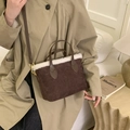 Brown faux suede bucket bag with white plush trim and golden hardware for winter - Brown
