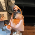 Pink and orange crossbody bag set with mini pouch shown in casual streetwear style - Pink