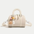 Creamy beige Boston handbag with woven texture, leather trim and cute bear charm pendant - Off White