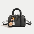 Dark grey denim Boston bag with black leather handles and cute decorative charms - Black