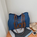 Blue denim tote bag with brown leather straps and vintage art print for daily use - Tan Denim Style