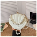 Close-up of white shell-shaped evening bag with gradient faux pearl handle and metal clasp - Style 2 White