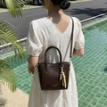 Dark brown glossy PU bucket bag with wooden bead charm and long shoulder strap - Brown